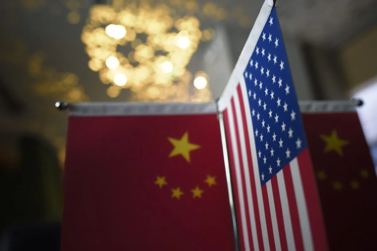 Chinese and American flags are displayed in a company in Beijing, on Aug. 16, 2017. (Wang Zhao/AFP via Getty Images)