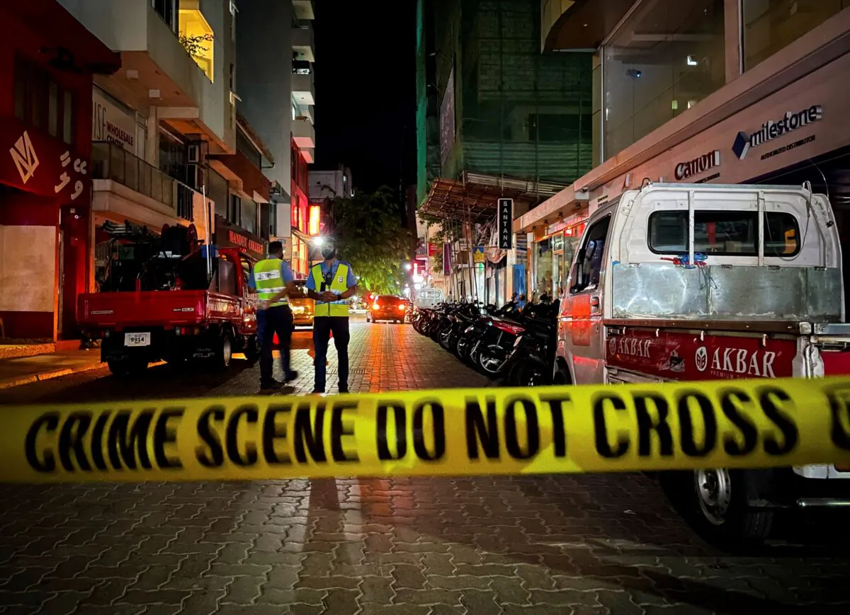 Maldivian police officers secure the area following a blast in Male, Maldives on Thursday, May 6, 2021. (Mohamed Sharuhaan/AP Photo)