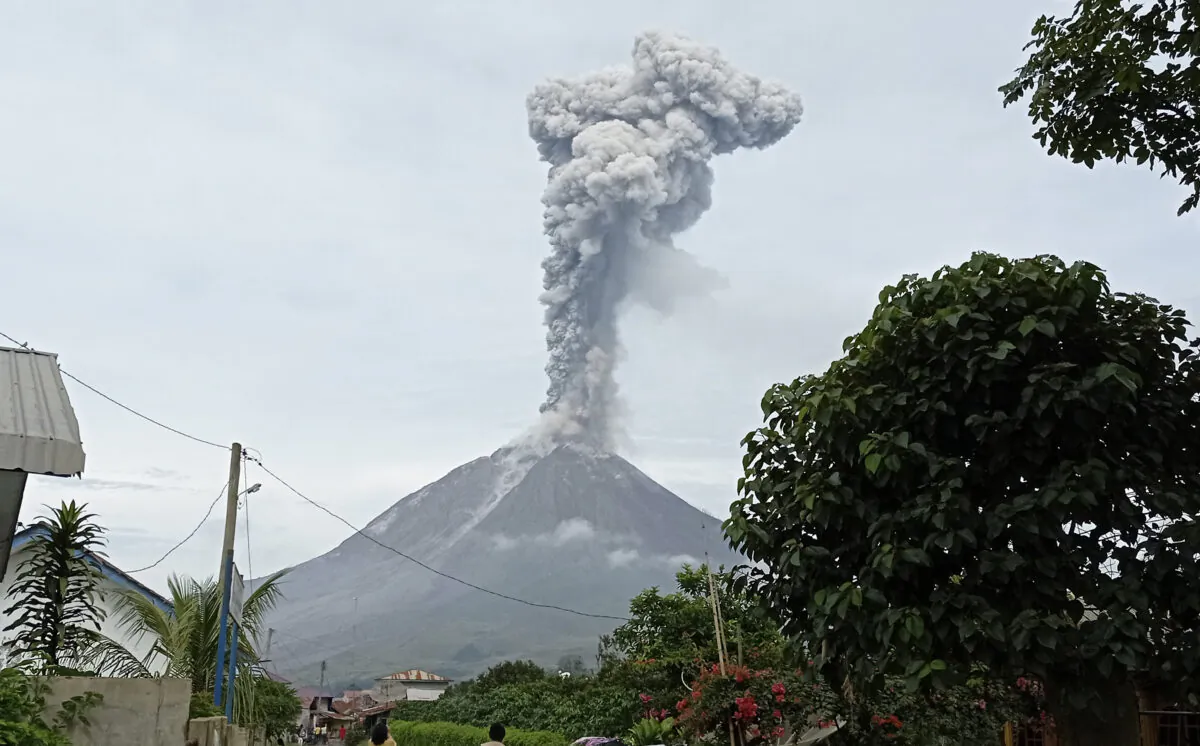 Mount Sinabung releases volcanic materials during an eruption in Karo, North Sumatra, Indonesia, on May 7, 2021. (Sastrawan Ginting/AP Photo)