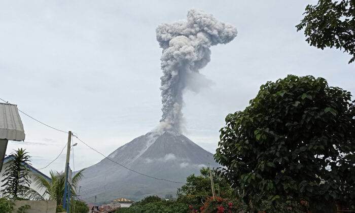 Mount Sinabung releases volcanic materials during an eruption in Karo, North Sumatra, Indonesia, on May 7, 2021. (Sastrawan Ginting/AP Photo)