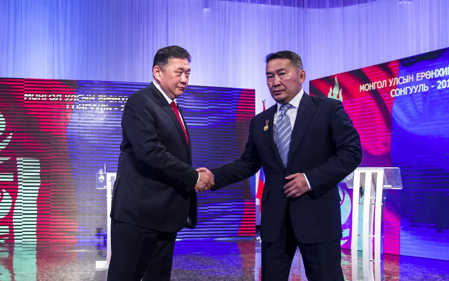 Mongolia's candidates for 2017 presidential election Enkhbold (L) and now-president Battulga (R) take part in a televised debate in Ulaanbaatar, Mongolia, on June 24, 2017. (Byambasuren Byamba-Ochir/AFP via Getty Images)