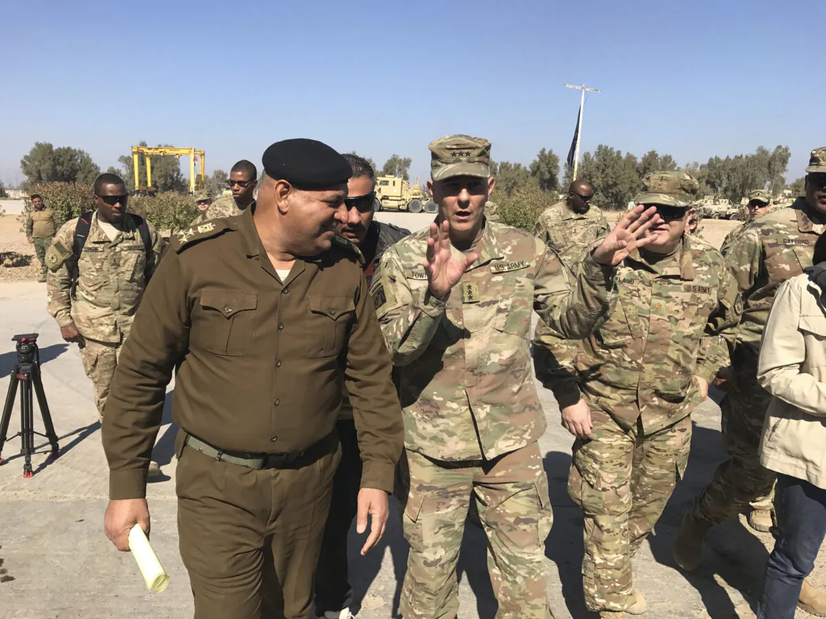 Then-Army Lt. Gen. Stephen Townsend talks with an Iraqi officer during a tour north of Baghdad, Iraq, on Feb. 8, 2017. (Ali Abdul Hassan/File/AP Photo)