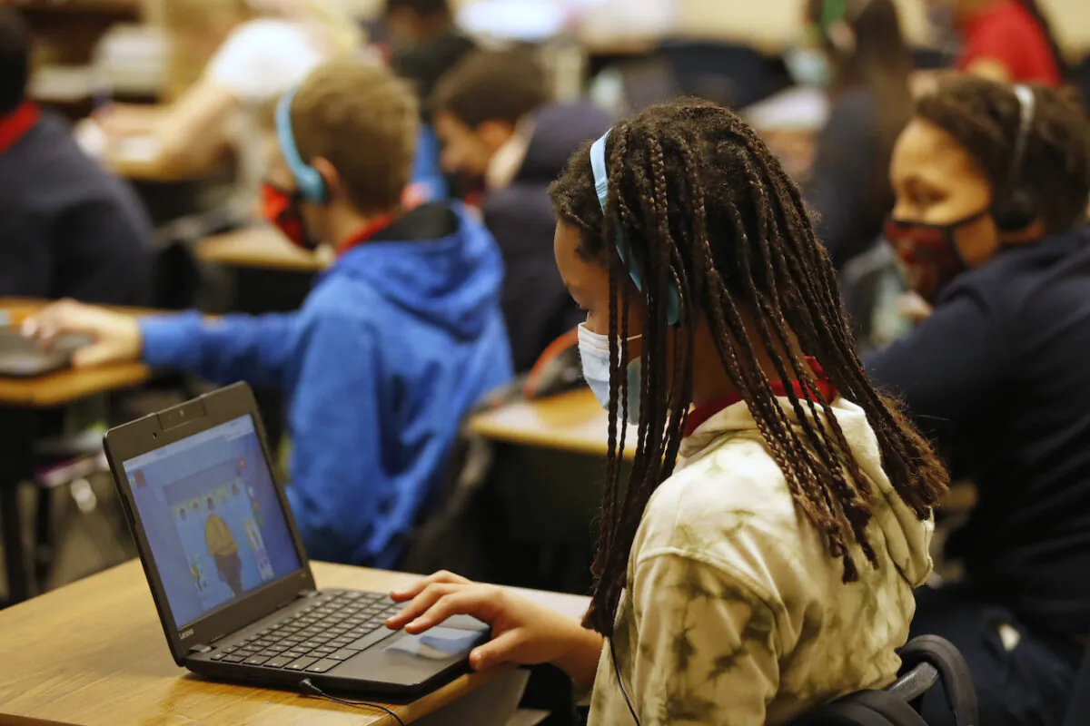 A school student works on a computer in Provo, Utah, on Feb. 10, 2021. (George Frey/Getty Images)