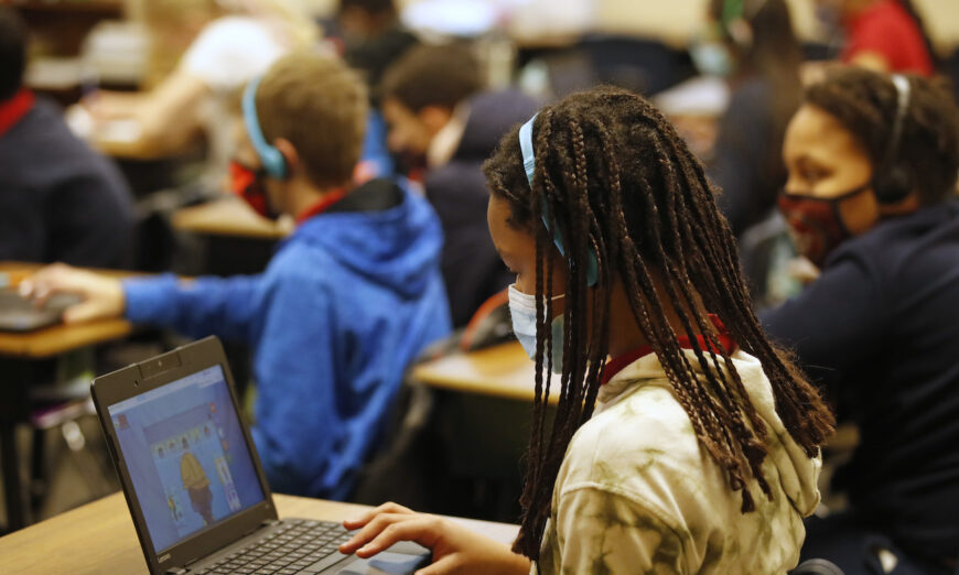 A school student works on a computer in Provo, Utah, on Feb. 10, 2021. (George Frey/Getty Images)