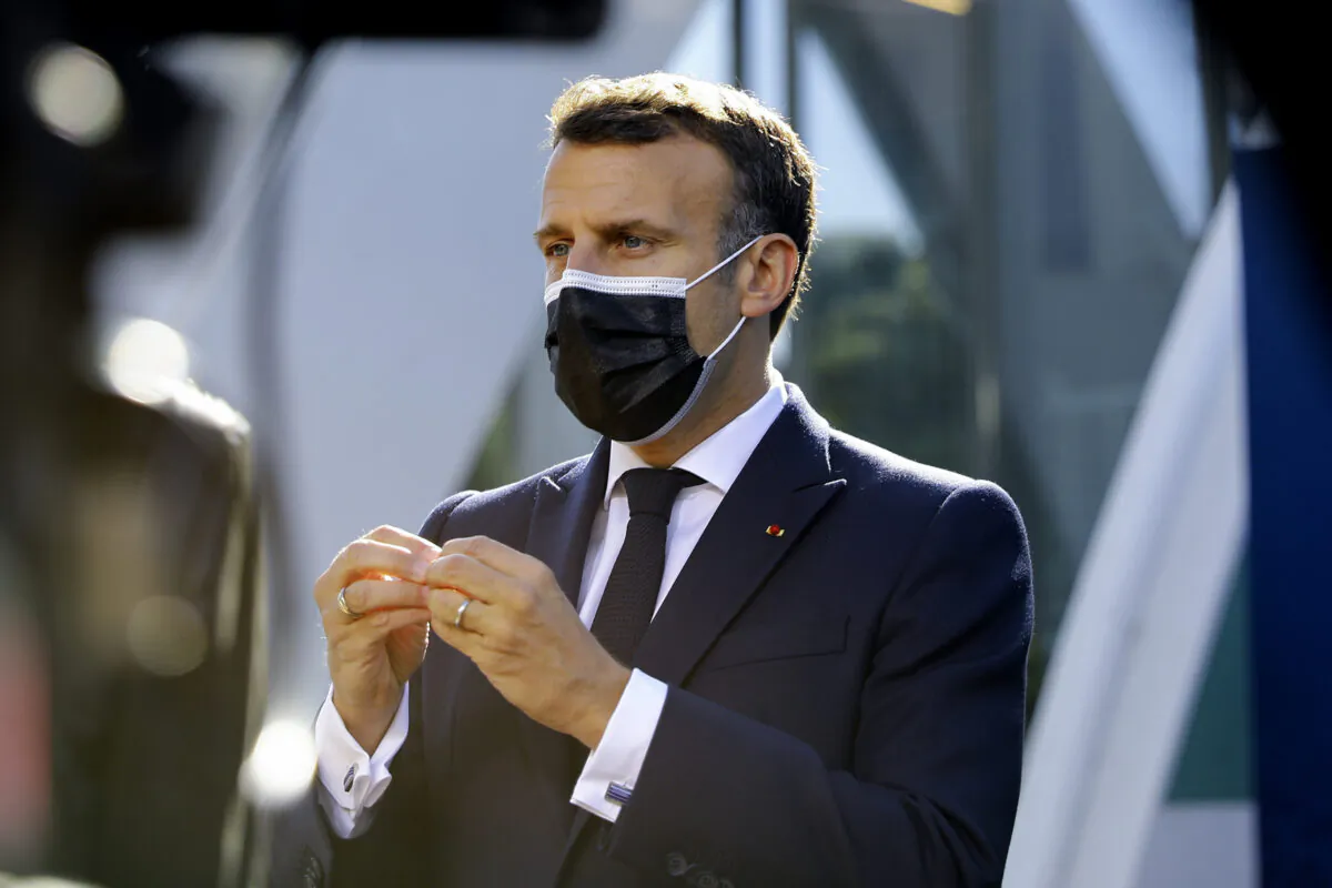 French President Emmanuel Macron speaks with the media as he arrives for an EU summit at the Crystal Palace in Porto, Portugal, on May 8, 2021. (Violeta Santos Moura /Pool via AP)
