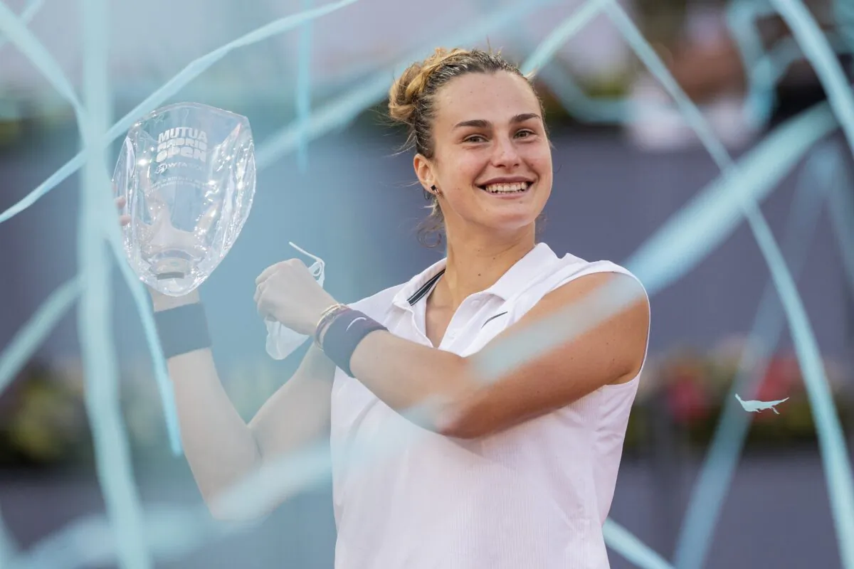 Aryna Sabalenka of Belarus holds a trophy after winning the women's final match against Australia's Ashleigh Barty at the Mutua Madrid Open tennis tournament in Madrid, Spain, on May 8, 2021. (Bernat Armangue/AP Photo)