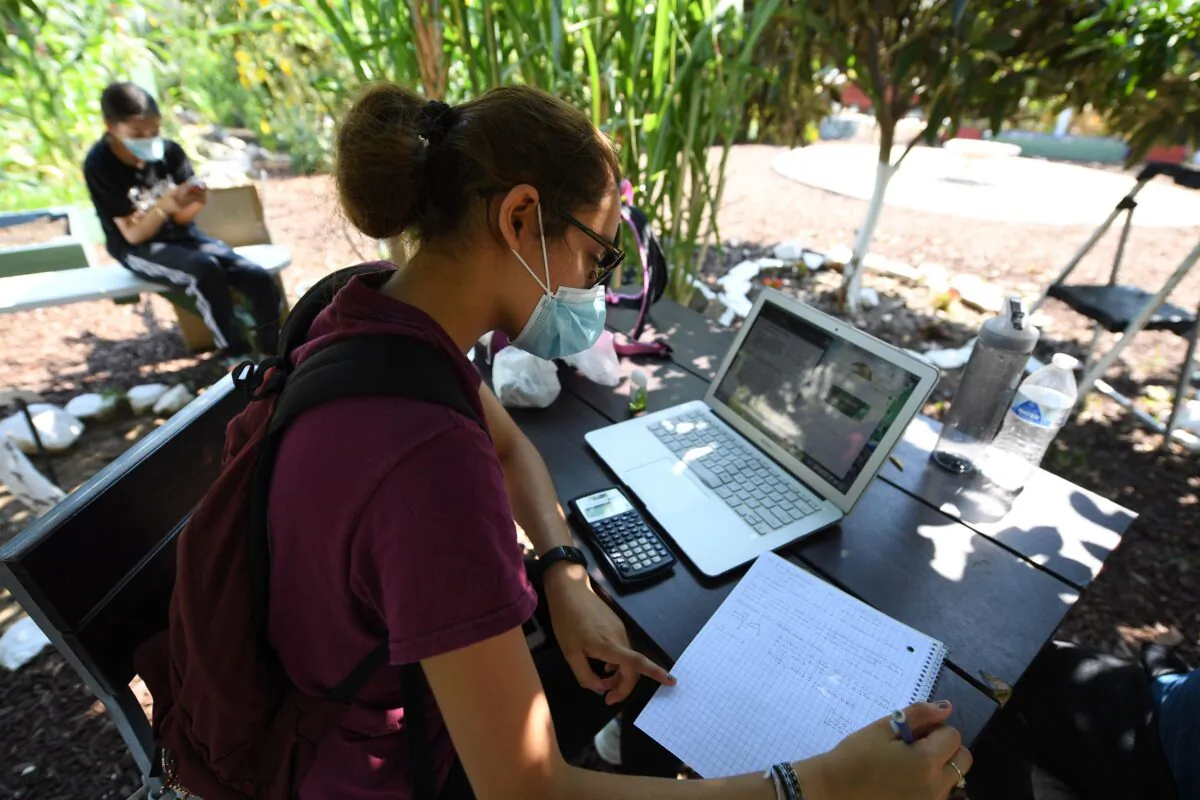 A college student follows a remote class in Los Angeles on Aug. 14, 2020. (ROBYN BECK/AFP via Getty Images)