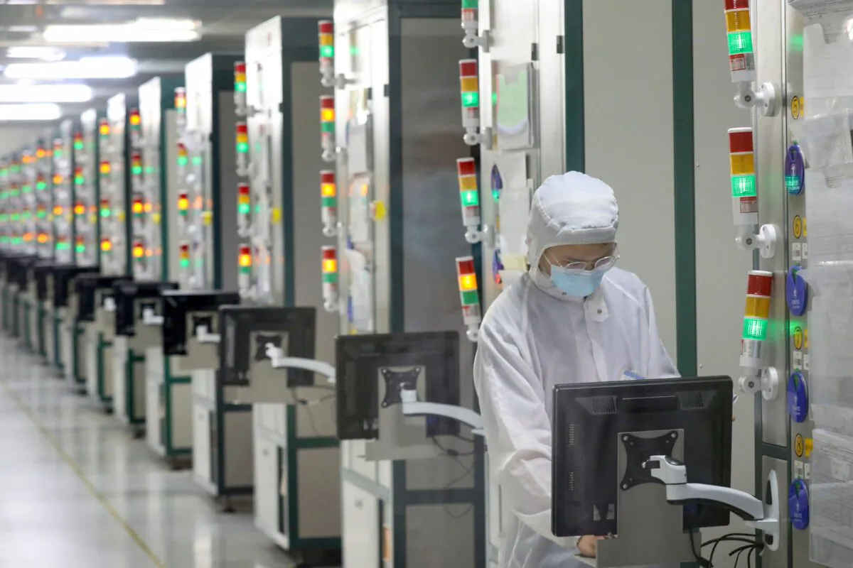 An employee works at a factory of Jiejie Semiconductor Company in Nantong, China, on March 17, 2021. (STR/AFP via Getty Images)