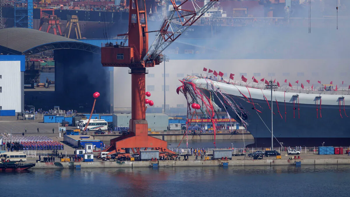 Type 001A, China's second aircraft carrier, is transferred from the dry dock into the water during a launch ceremony at Dalian shipyard in Dalian, northeast China's Liaoning Province, on April 26, 2017. (STR/AFP via Getty Images)
