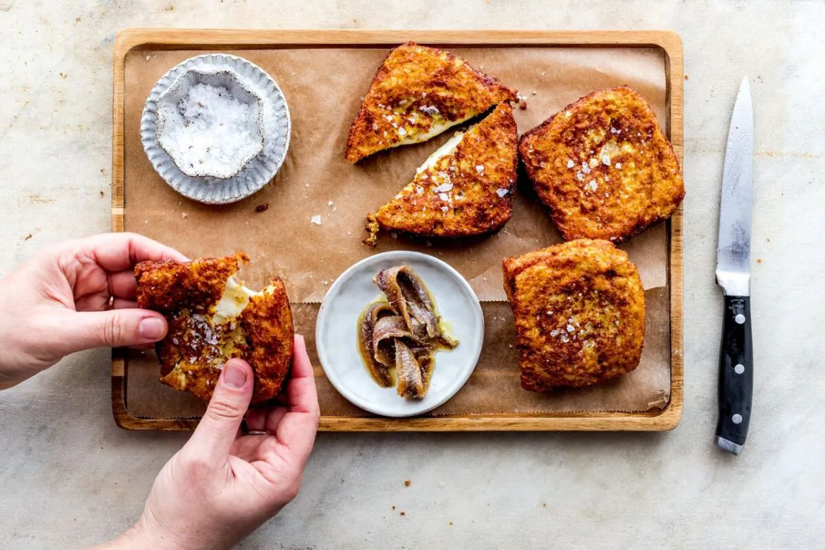 The anchovies smuggled into these fried mozzarella sandwiches cut through the richness of the cheese. (Giulia Scarpaleggia)