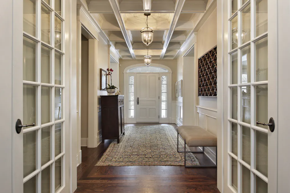 Don't scrimp on some of the open areas such as the foyer or entrance to a stairway, even though these two areas are not particularly usable floor space.  (pics721/Shutterstock)