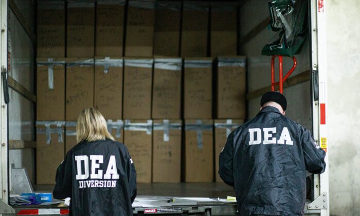 Prescriptions drugs collected during the Drug Enforcement Administration (DEA)s Take Back Day event are placed into plastic bags by members of the DEA in White Plains, New York on April 24, 2021. (Kena Betancur/AFP via Getty Images)