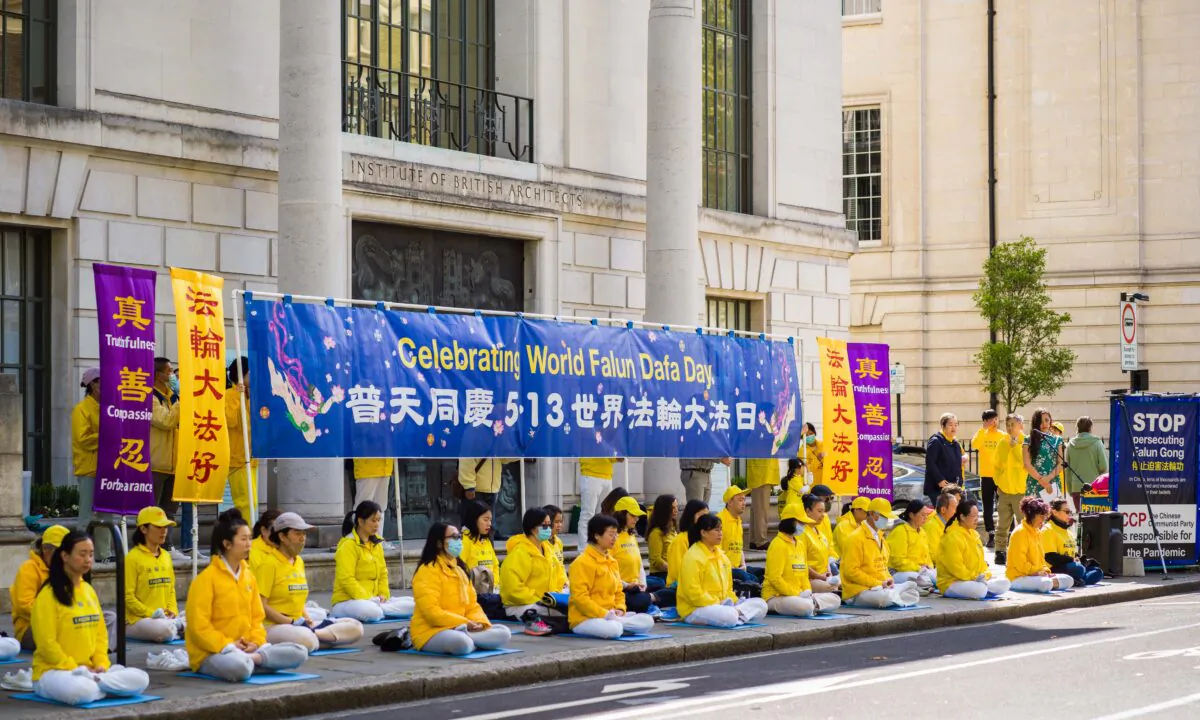 Falun Gong practitioners celebrate World Falun Dafa Day in central London on May 10, 2021. (Yanning Qi/The Epoch Times)