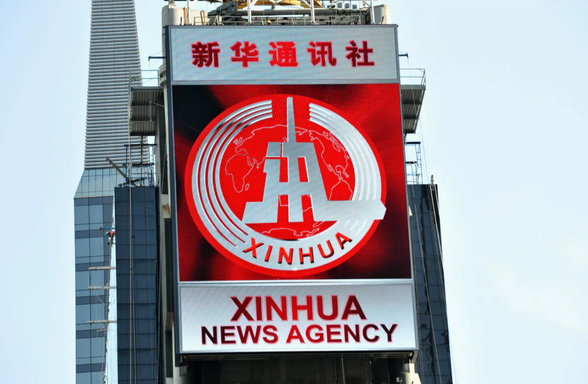 An electronic billboard leased by Xinhua, the news agency operated by the Chinese regime, makes its debut in New York's Times Square on Aug. 1, 2011. (Stan Honda/AFP via Getty Images)