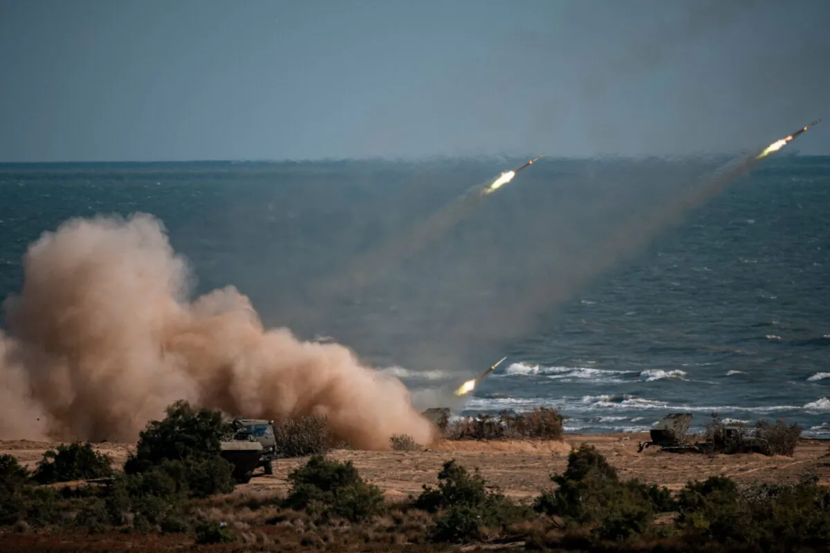 Rockets launch from missile systems at the Turali range on the Caspian Sea coast in the Republic of Dagestan in Southern Russia during the "Caucasus-2020" military drills gathering China, Iran, Pakistan and Myanmar troops, along with ex-Soviet Armenia, Azerbaijan and Belarus, on Sept. 23, 2020. (Dimitar Dilkoff/AFP via Getty Images)
