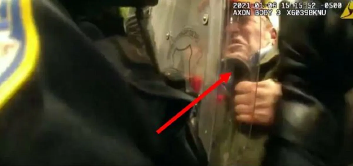 In a still image from body-camera footage, a man identified by the FBI as Frederico Klein, right, clashes with law enforcement officers outside the U.S. Capitol on Jan. 6, 2021. (FBI)