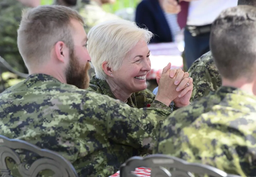 Brigadier-General Jennie Carignan of the Canadian Armed Forces joins soldiers during a lunch with Prime Minister Justin Trudeau and Secretary General of the North Atlantic Treaty Organization (NATO) Jens Stoltenberg at Canadian Forces Base Petawawa, Ont. on July 15, 2019. A parliamentary committee will hear this morning from Carigan,  who was recently tapped to lead the military's efforts to change its culture. (Sean Kilpatrick/The Canadian Press)