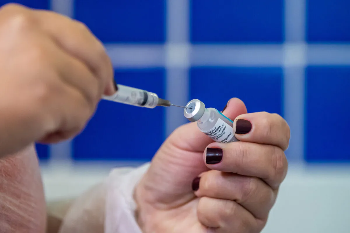 A nurse fills a syringe from a vial containing AstraZeneca's COVID-19 vaccine during vaccination day for health workers at health center Posto Central in Maricá, Brazil on April 27, 2021. (Buda Mendes/Getty Images) 