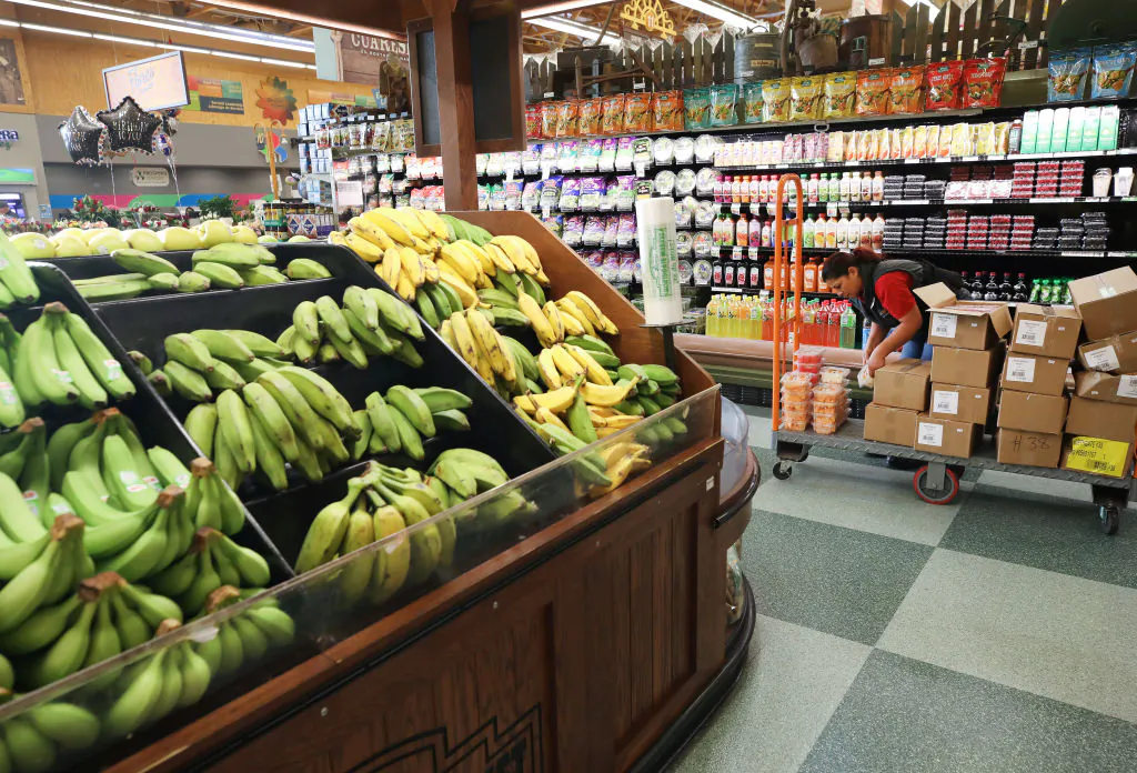 A worker re-stocks items at Northgate Gonzalez Market on March 19, 2020 in Los Angeles, Calif. (Mario Tama/Getty Images)