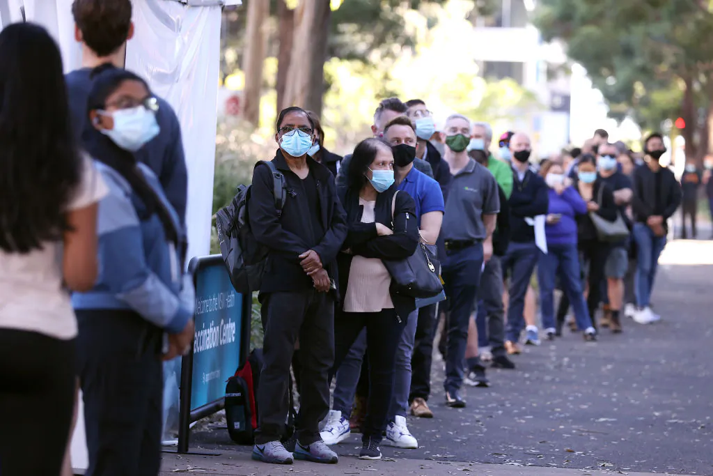People are seen queuing to enter a mass COVID-19 vaccination hub in Sydney, Australia, on May 10, 2021. (Mark Kolbe/Getty Images)