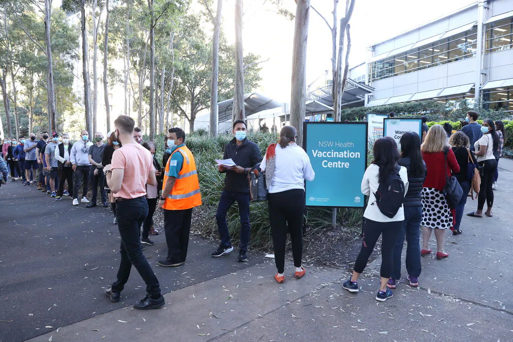 People are seen queuing to enter a mass COVID-19 vaccination hub in Sydney, Australia, on May 10, 2021. (Mark Kolbe/Getty Images)