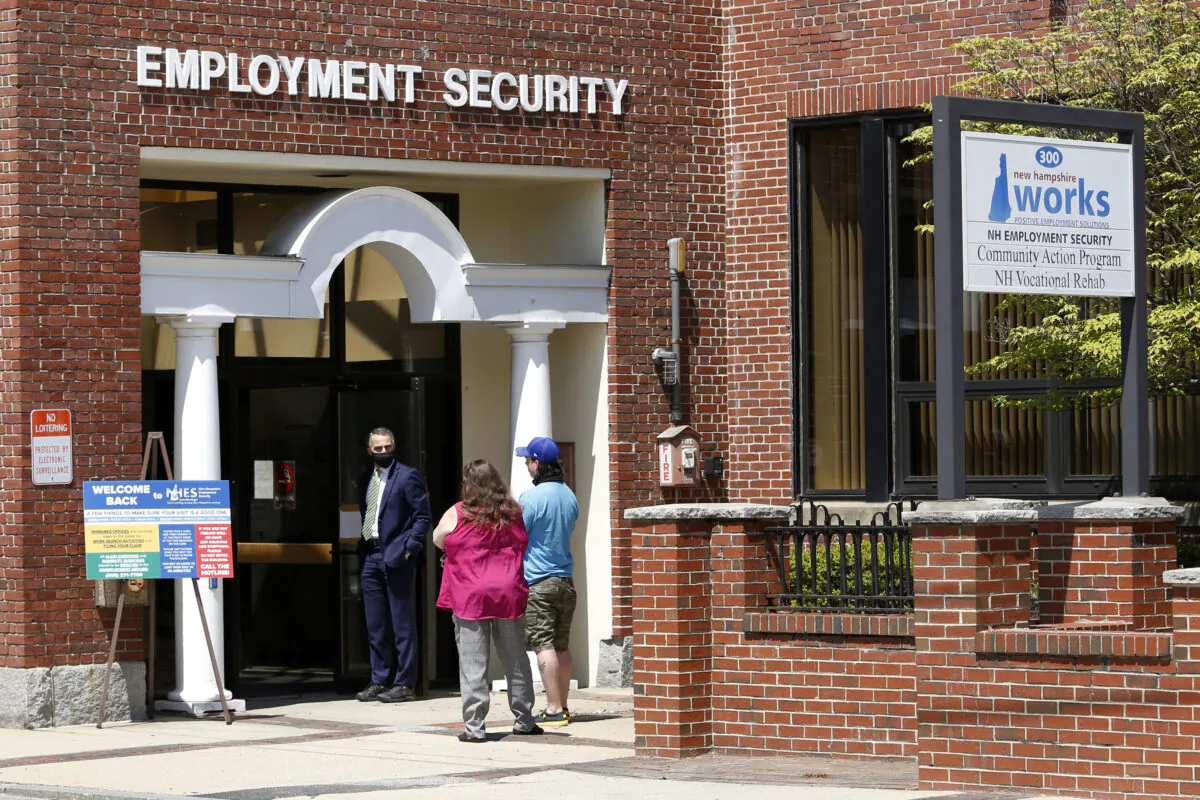 Job seekers line up outside the New Hampshire Works employment security job center in Manchester, N.H., on May 10, 2021. (Mary Schwalm/AP Photo)