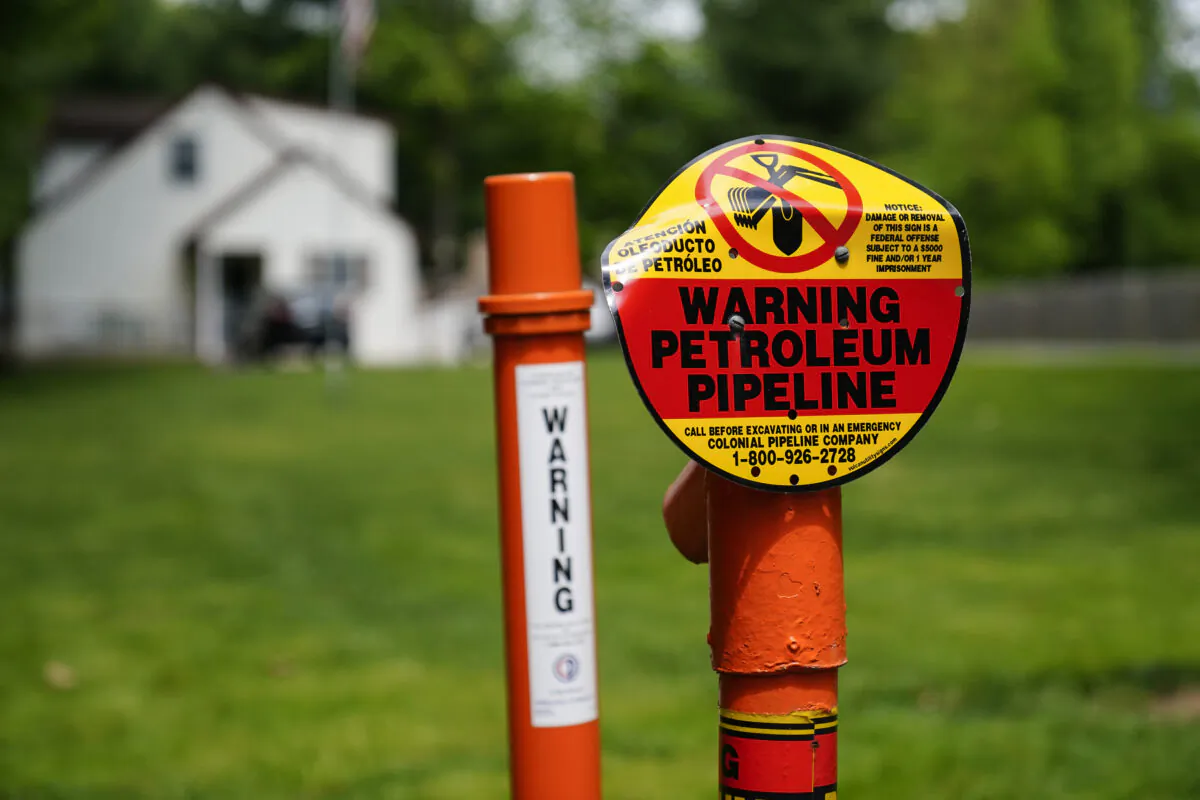 A warning sign is posted along the path of the Colonial Pipeline in Garnet Valley, PA. on Monday, May 10, 2021. (Matt Rourke/AP Photo)