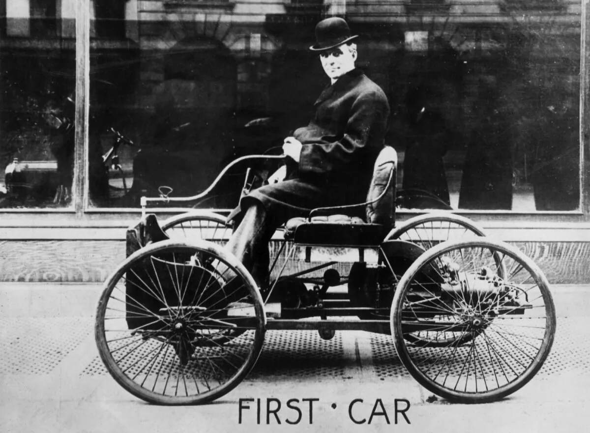 American inventor and industrialist, Henry Ford (1863–1947) posing in the driving seat of his first car, the Quadricycle, New York City, 1910. (Spooner & Wells/Hulton Archive/Getty Images)