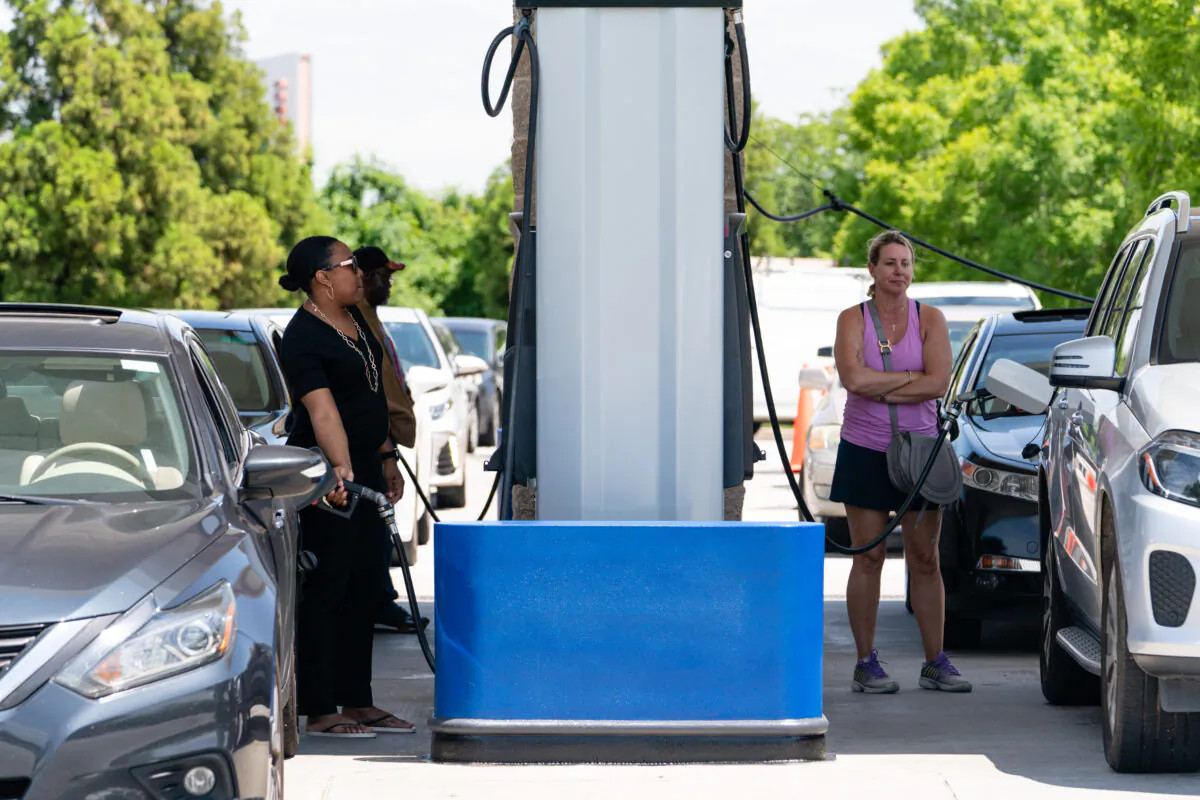 People pump gas at a Costco gasoline station in Atlanta, Ga., on May 11, 2021. (Elijah Nouvelage/AFP via Getty Images)