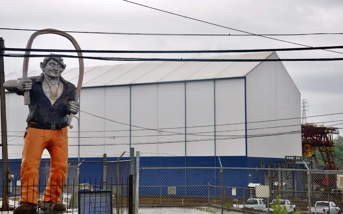 The statue of Joe Magarac, a folktale steelworker who could bend steel with his bare hands, is seen in front of the 148-year-old Edgar Thomson Works. (Shannon Venditti)
