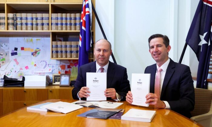 Treasurer Josh Frydenberg and Finance Minister Simon Birmingham with the 2021 budget papers at Parliament House on May 11, 2021 in Canberra, Australia. (Dominic Lorrimer - Pool/Getty Images)