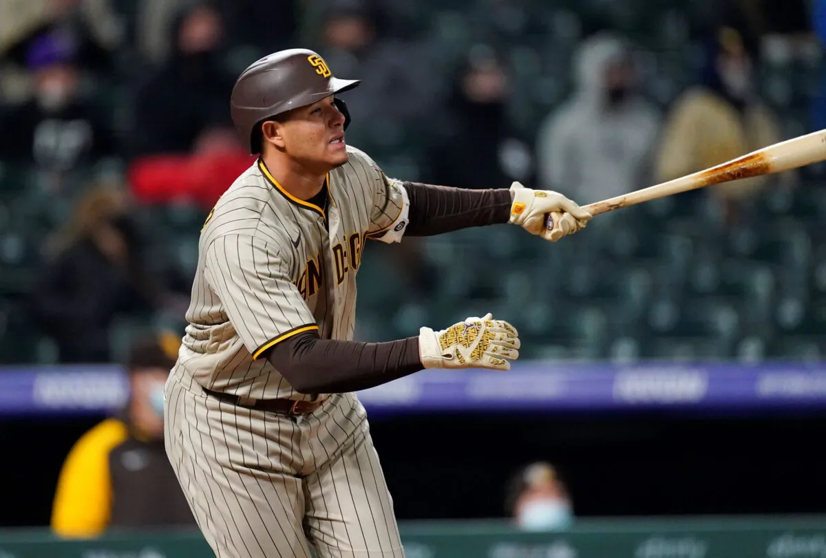 San Diego Padres' Manny Machado watches his three-run triple off Colorado Rockies relief pitcher Tyler Kinley during the sixth inning of a baseball game in Denver, Colo., on May 11, 2021. (David Zalubowski/AP Photo)