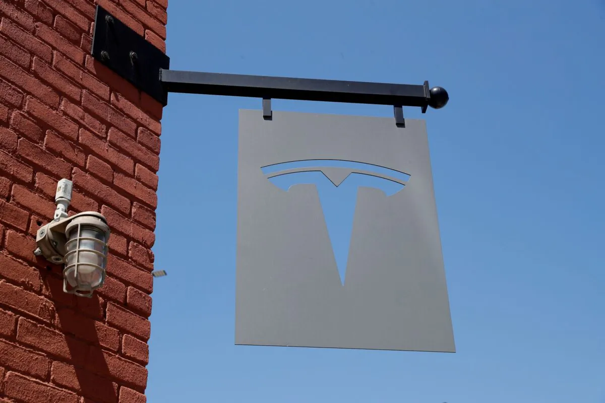 The TESLA logo is seen outside a dealership in the Brooklyn borough of New York City on April 26, 2021. (Shannon Stapleton/Reuters)