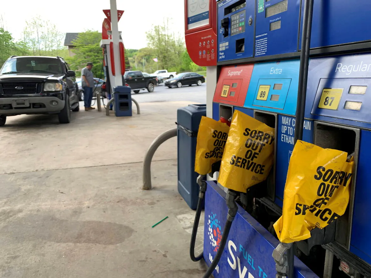Out of service fuel nozzles are covered in plastic on a gas pump at a gas station after a gasoline supply crunch caused by the Colonial Pipeline hack, in Waynesville, North Carolina, on May 11, 2021. (Martin Brossman via Reuters)