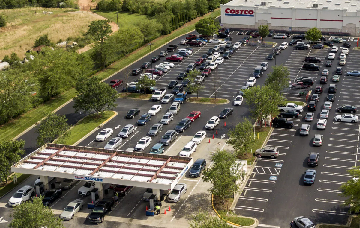 In this aerial image taken with a drone, numerous vehicles line up for gasoline at Costco on Wendover Avenue in Greensboro, N.C., on, May 11, 2021. (Woody Marshall/News & Record via AP)
