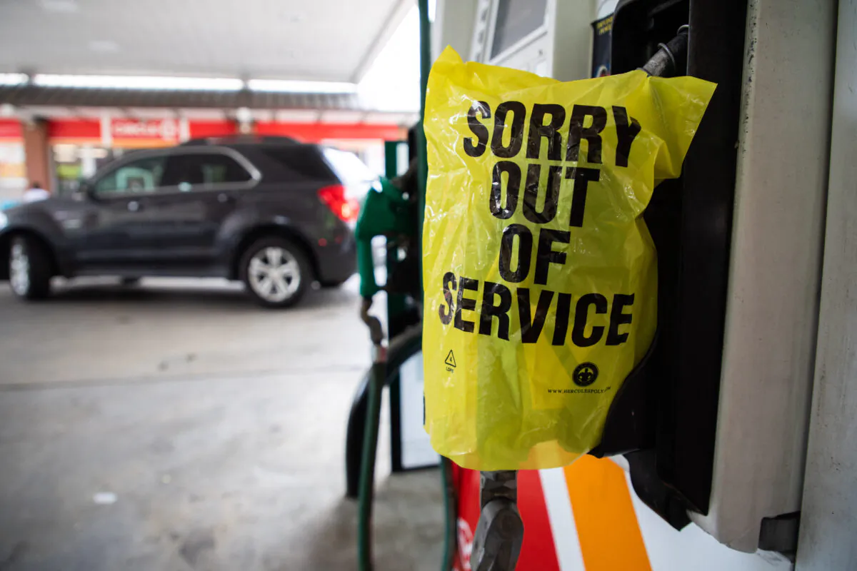 An "Out Of Service" bag covers a gas pump at a station in Charlotte, N.C., on May 11, 2021. (Logan Cyrus/AFP via Getty Images)