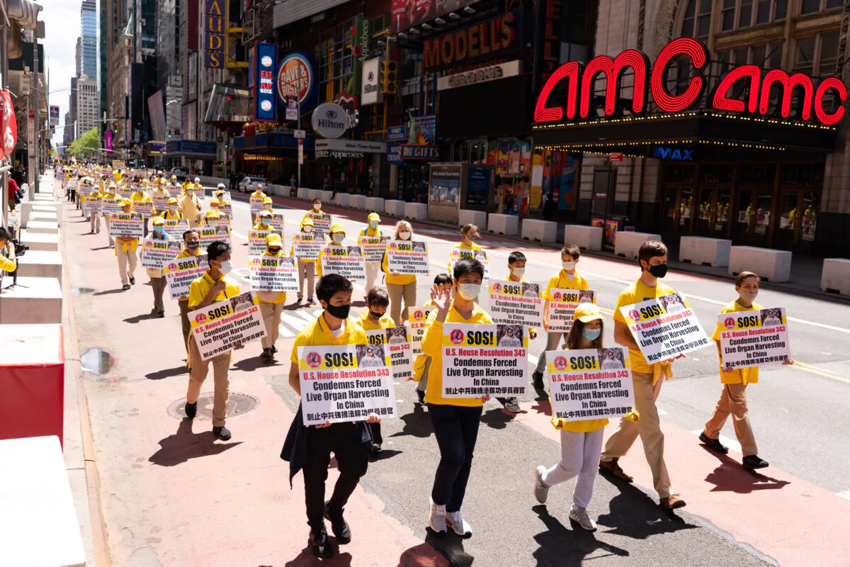Practitioners of the spiritual discipline Falun Gong hold a parade in New York to celebrate World Falun Dafa Day and to protest the ongoing persecution of the group by the Chinese Communist Party in China, on May 13, 2020. (Larry Dai/The Epoch Times)