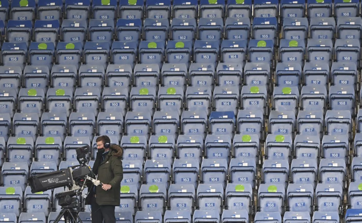 A TV cameraman sets up his camera before the start of the English Premier League soccer match between Chelsea and Fulham at Stamford Bridge Stadium in London, on May 1, 2021. (Justin Setterfield/Pool via AP)