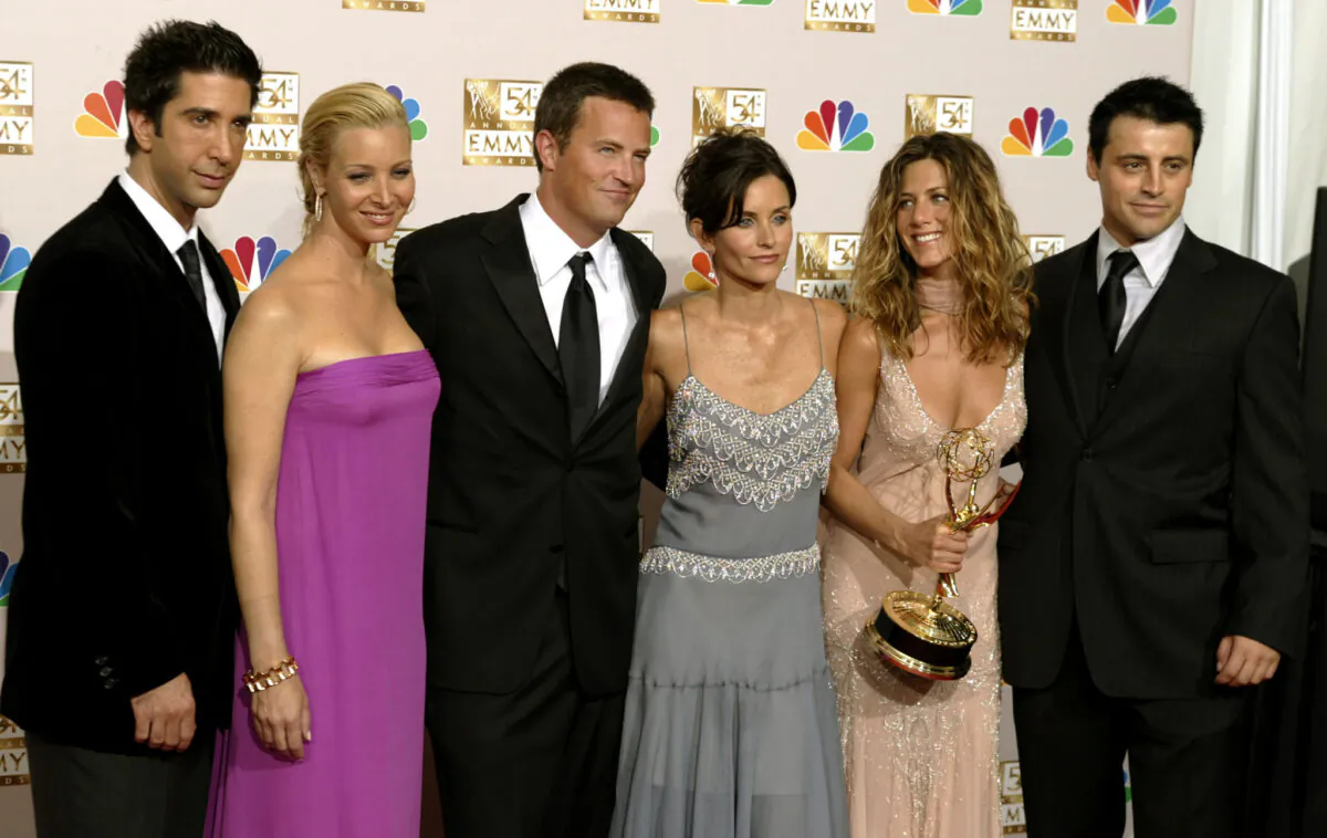 The cast of "Friends" (L to R): David Schwimmer, Lisa Kudrow, Matthew Perry, Courteney Cox, Jennifer Aniston, and Matt LeBlanc appear in the photo room at the 54th annual Emmy Awards, in Los Angeles, Calif., on Sept. 22, 2002. (Mike Blake/Reuters)