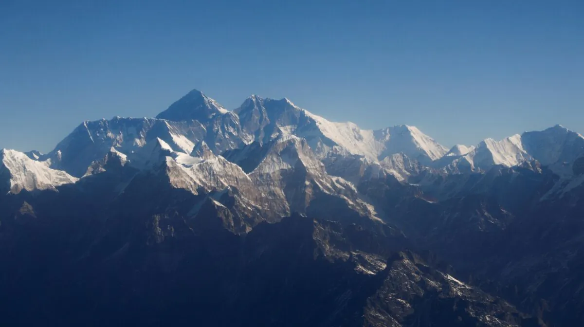 Mount Everest, the world's highest peak, and other peaks of the Himalayan range are seen through an aircraft window during a mountain flight from Kathmandu, Nepal, on Jan. 15, 2020. (Monika Deupala/File Photo/Reuters)
