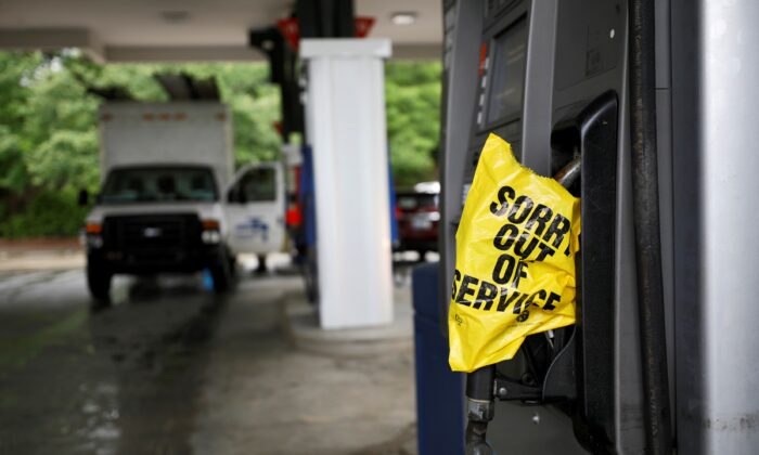 A bagged nozzle at a pump notifies motorists that it no longer has fuel after a cyberattack crippled the biggest fuel pipeline in the country, run by Colonial Pipeline, in Chapel Hill, N.C., on May 12, 2021. (Jonathan Drake/Reuters)