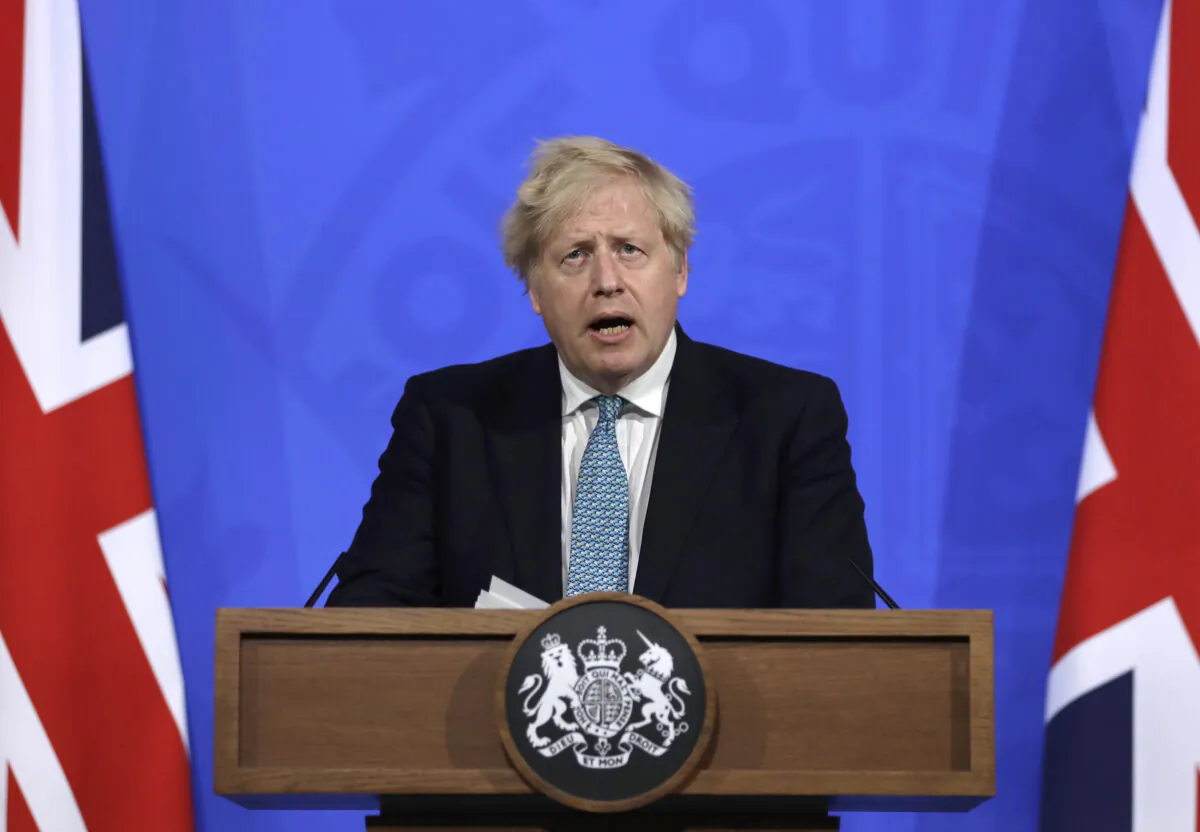 Britain's Prime Minister Boris Johnson speaks at a press conference about the ongoing COVID-19 outbreak at Downing Street on May 14, 2021. (Matt Dunham-WPA Pool/Getty Images)