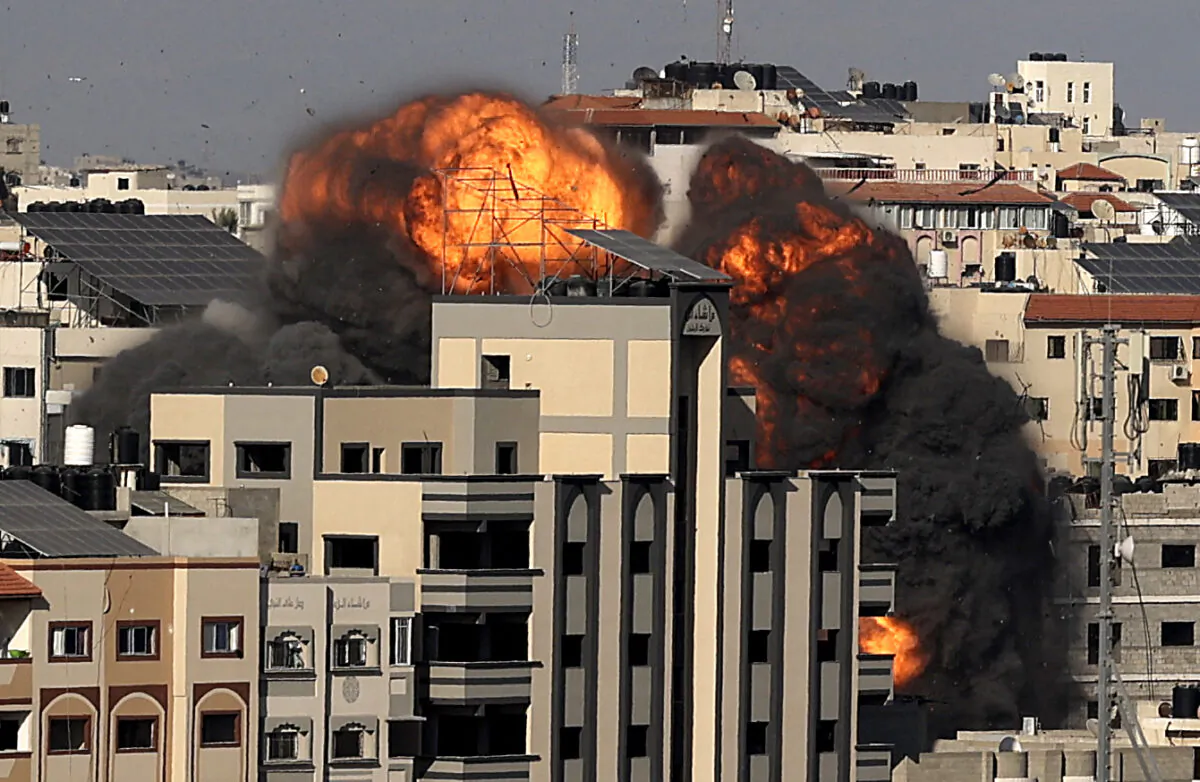 A picture shows the explosion after an Israeli strike targeted a building in Gaza City, on May 14, 2021. (Mahmud Hams/AFP via Getty Images)