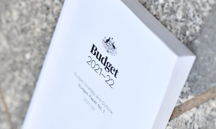 A stock image of the 2021-2022 Australian Budget is seen on the ground at Parliament House in Canberra, Australia, on May 12, 2021. (Sam Mooy/Getty Images)