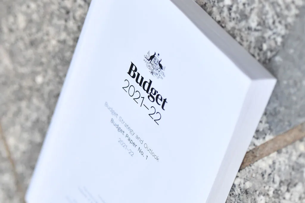 A stock image of the 2021-2022 Australian Budget is seen on the ground at Parliament House in Canberra, Australia, on May 12, 2021. (Sam Mooy/Getty Images)