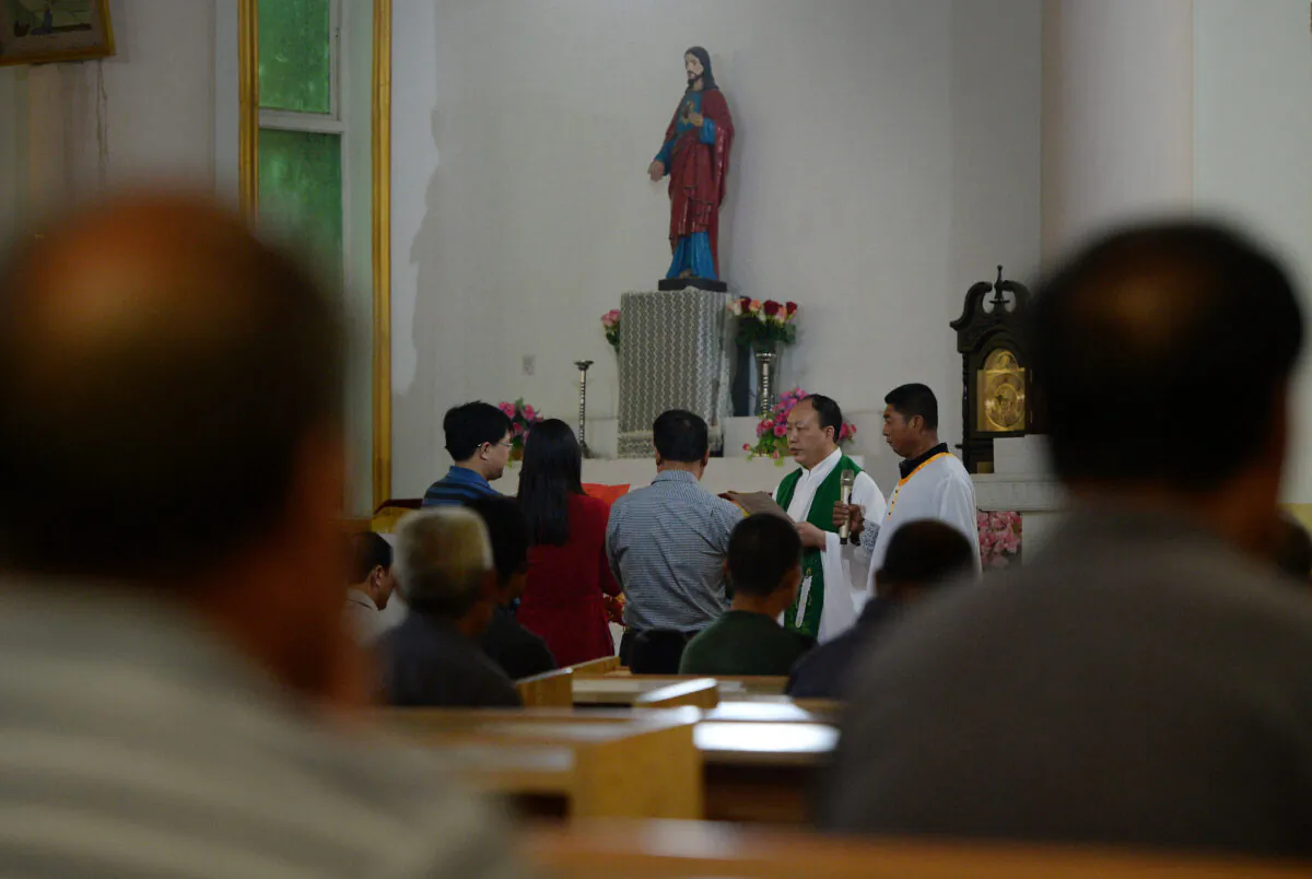 Chinese Catholics, who belong to an "underground" church, attend a mass in Donglu, Hebei Province, China, on May 22, 2013. (Mark Ralston/AFP via Getty Images)