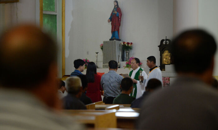 Chinese Catholics, who belong to an "underground" church, attend a mass in Donglu, Hebei Province, China, on May 22, 2013. (Mark Ralston/AFP via Getty Images)