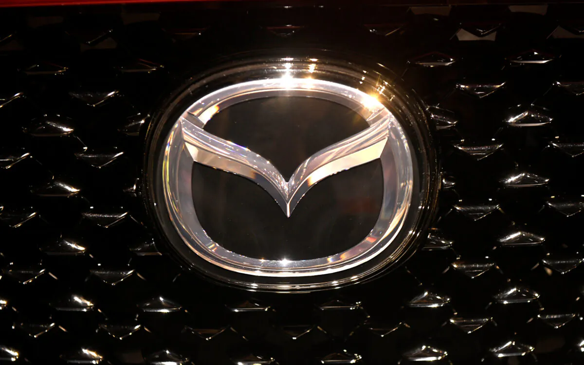 The logo of Mazda is pictured at the LA Auto Show in Los Angeles, California, on Nov. 20, 2019. (Andrew Cullen/Reuters)