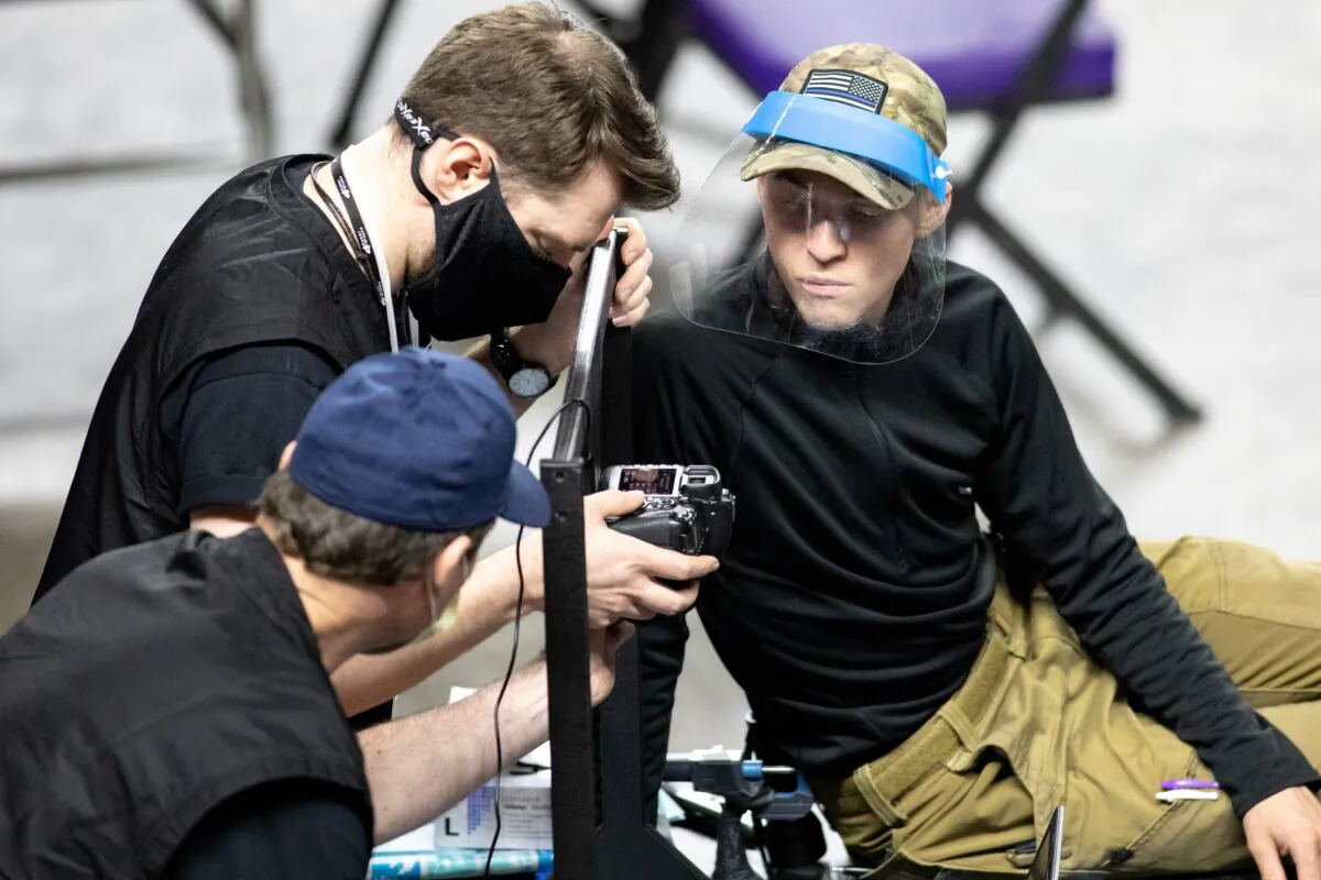 Contractors working for Cyber Ninjas, which was hired by the Arizona Senate, examine and recount ballots from the 2020 general election at Veterans Memorial Coliseum in Phoenix, Ariz., on May 1, 2021. (Courtney Pedroza/Getty Images)