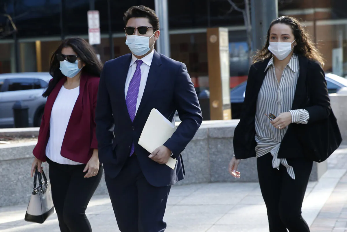 Former Fall River Mayor Jasiel Correia (C) arrives at the John Joseph Moakley United States Courthouse in Boston, Mass., on April 26, 2021. (Jessica Rinaldi/The Boston Globe via AP)